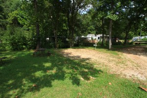 A partly shady 30 amp and water back in on the creek.  Close to store, bath house, and pool.  View of the southern sky.