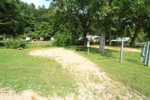 A large, flat 30 Amp and water back in site located on the creek.  Shaded part of the day  with views of pool and grounds. 